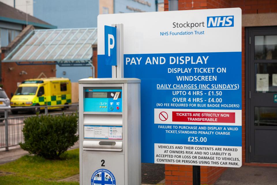 Pay and Display meter to issue tickets, and charges / parking charging rate sign, in an NHS hospital Car Park. UK. Image shot 2013. Exact date unknown.