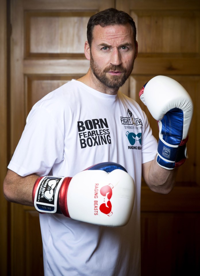 Charity work . . . Colin puts his dukes up promoting a charity boxing bash for Care After Combat
