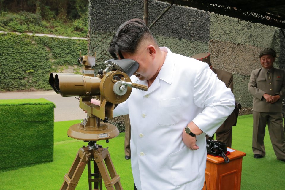 North Korean leader Kim Jong Un provides field guidance during a fire drill of ballistic rockets by Hwasong artillery units of the KPA Strategic Force