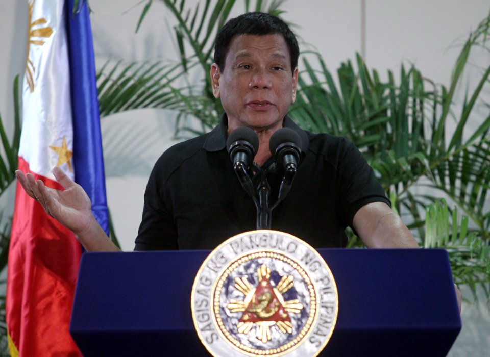 Philippines President Rodrigo Duterte gestures during a news conference upon his arrival from Vietnam trip at the International Airport in Davao city
