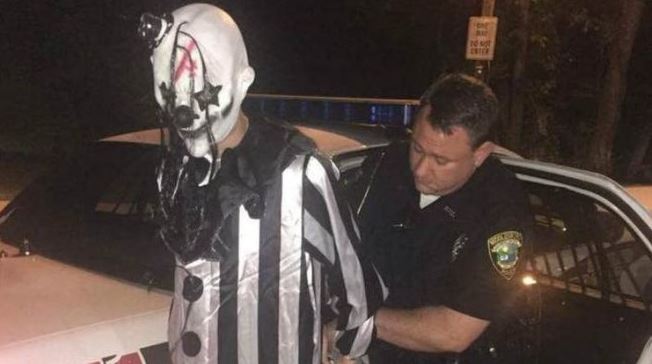 Man In Clown Costume Against Wall During Halloween