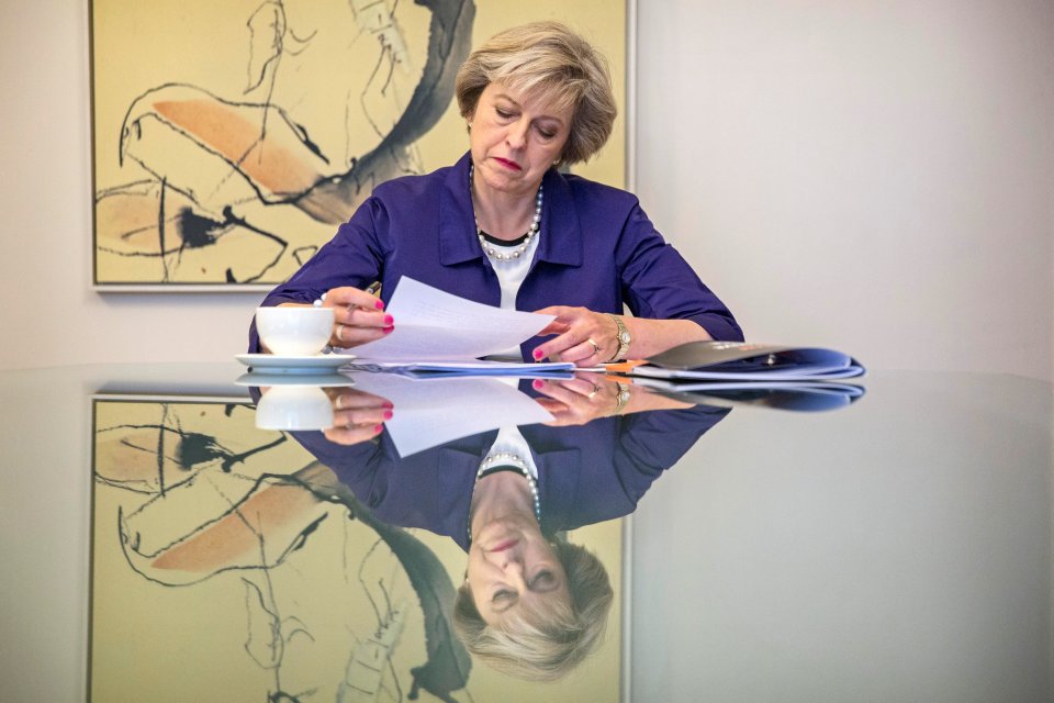 Britain's Prime Minister Theresa May sits in her hotel room as she prepares her conference speech in Birmingham