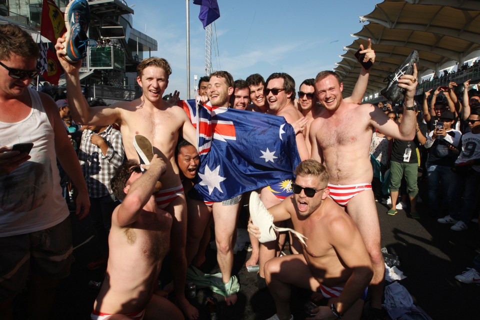Australian men pose for a photo in Budgy Smuggler-brand