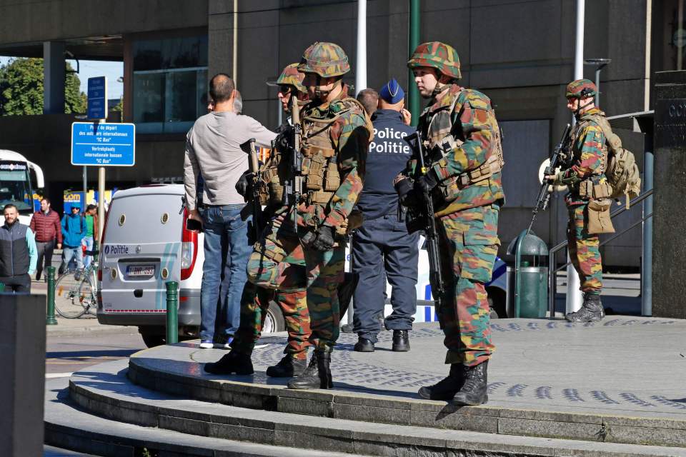 Police and army personnel stand guard du
