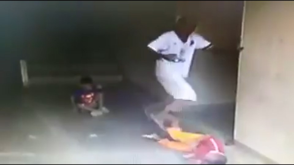 Brutal ... Father storms down stairs and immediately boots poor boy on the head