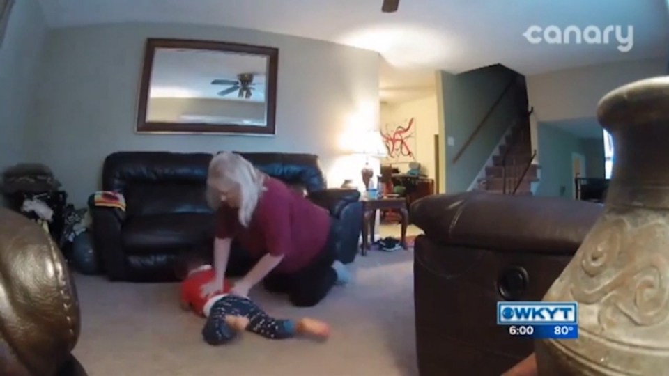 She flips little Luke over before dragging him across the floor