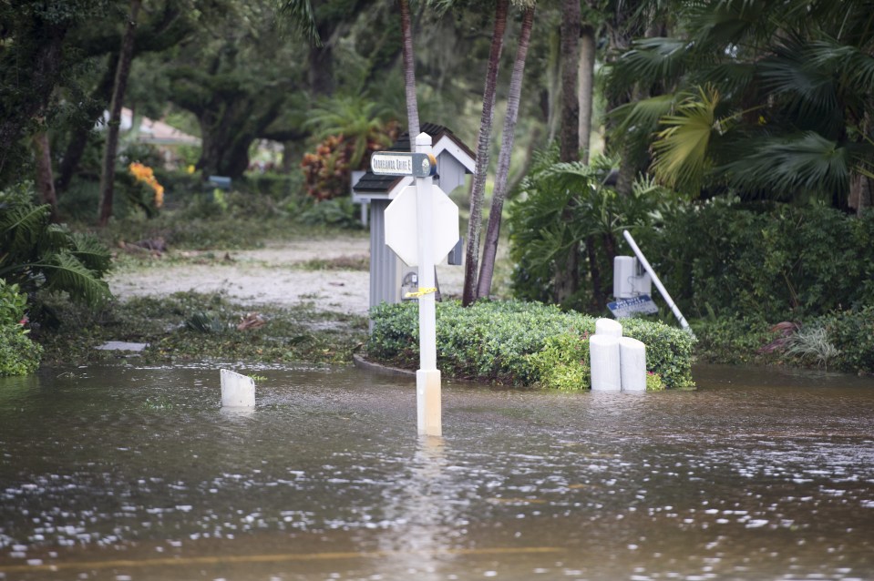Parts of central Florida suffered heavy flooding as forecasters predict a foot of rainfall to batter down on North Carolina 