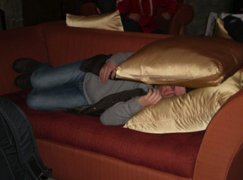 Stephen Woolfe passed out drunk on a sofa