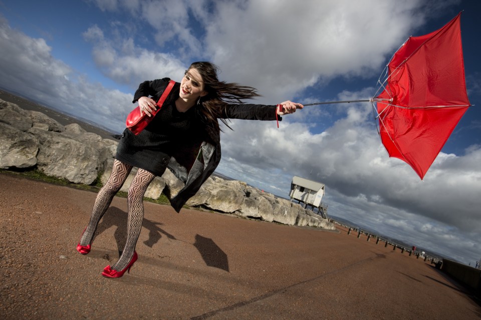 Caucasian female (20's) on Morecambe promenade, Lancashire, UK