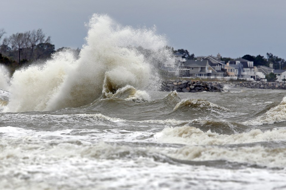Waves crash ashore near Fort Monroe, Va., Sunday Oct. 9, 2016 in the aftermath of Hurricane Matthew