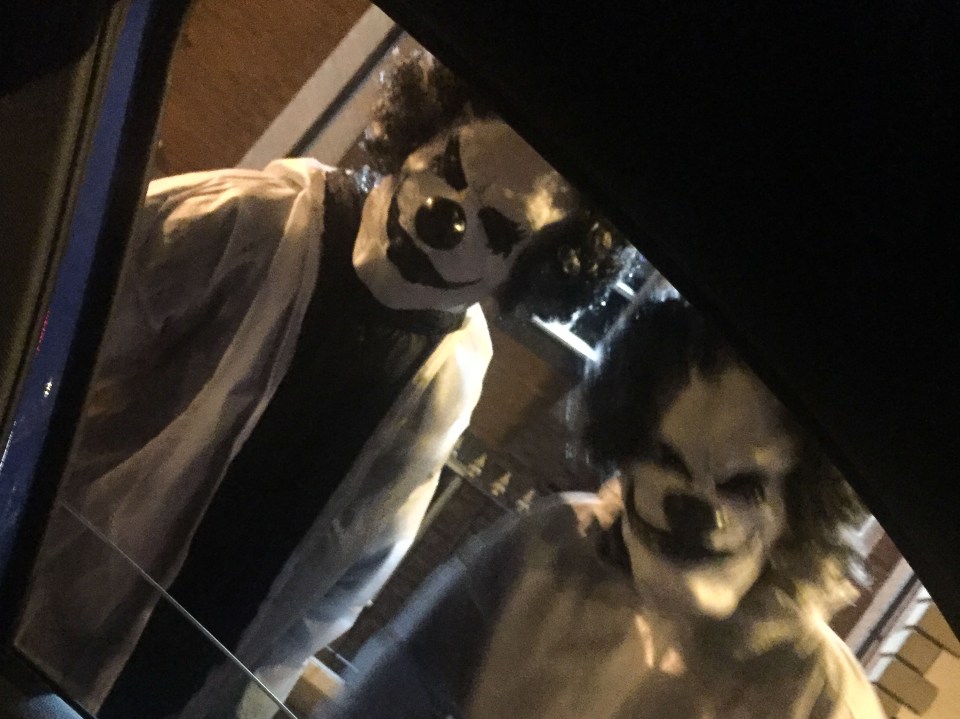 Clowns armed with machetes terrorised drivers who stopped at a set of traffic lights in Manchester