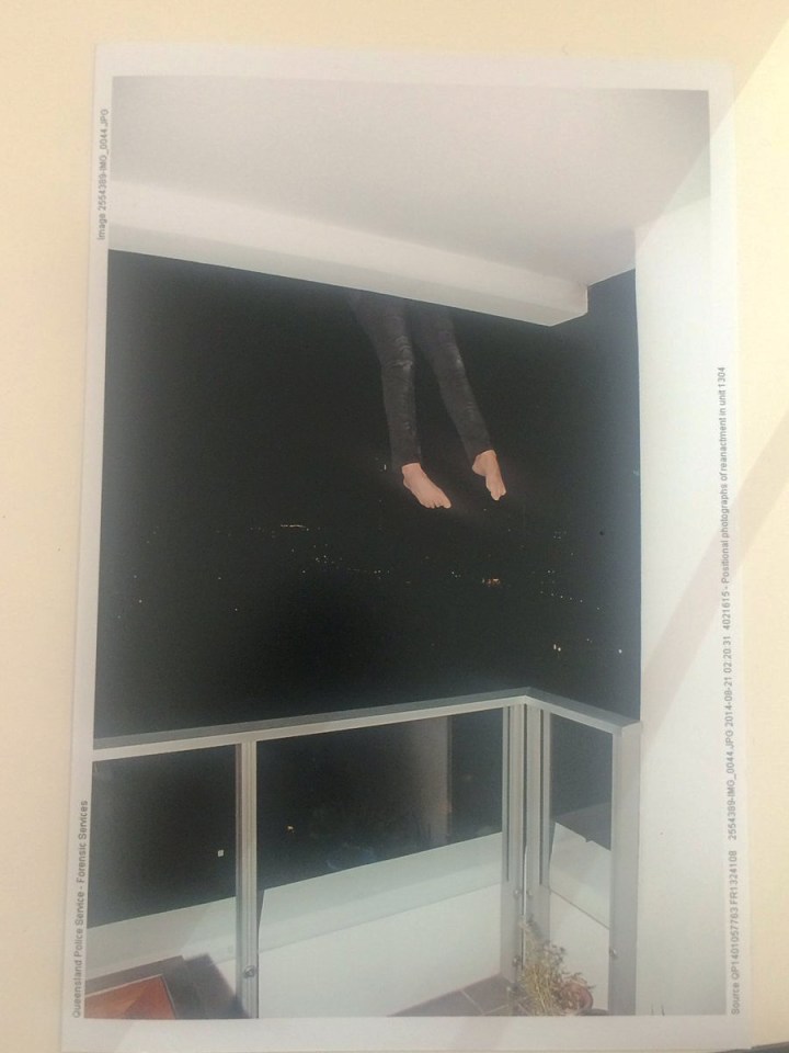A police officer recreates the moment Warriena Wright hung over the balcony 