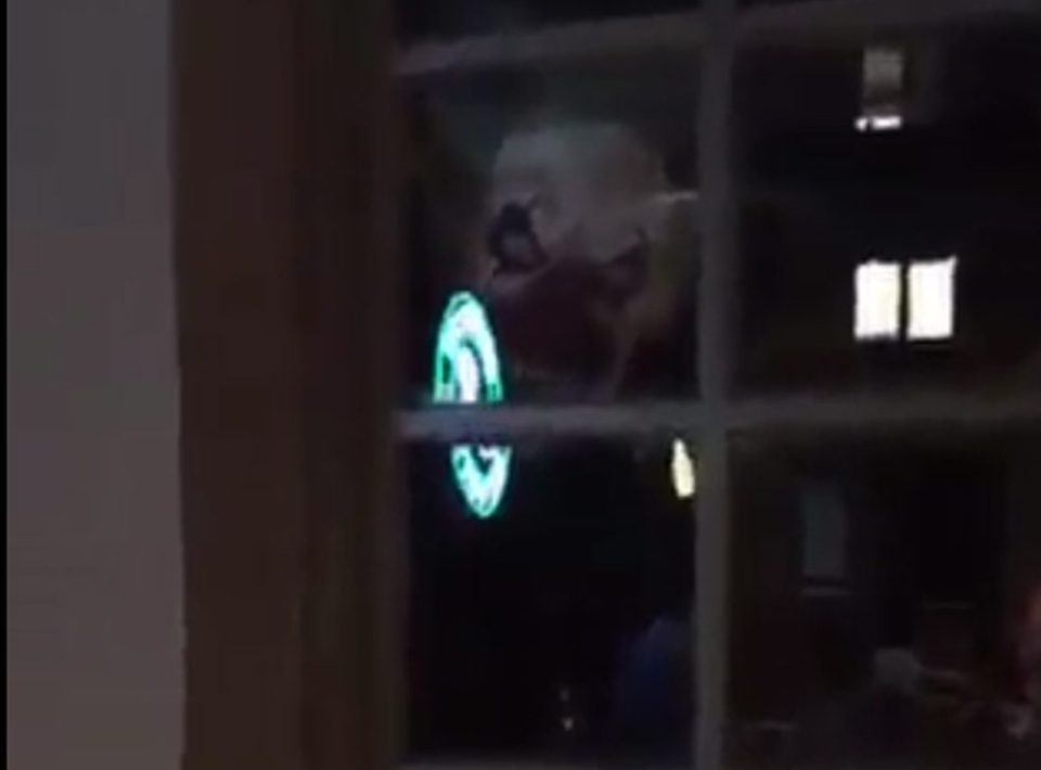 This is the terrifying moment a killer clown appeared in the window of a restaurant as a group of friends gathered for an evening meal