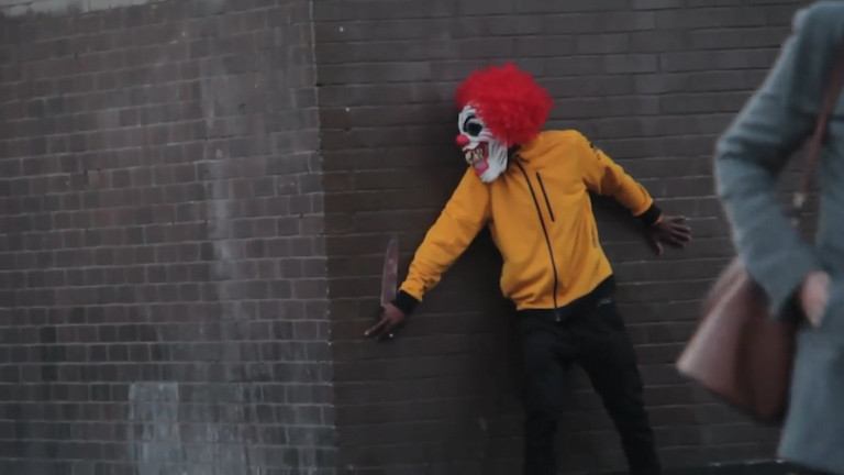 Prankster dressed as a 'killer clown' got knocked out after scaring shoppers in London