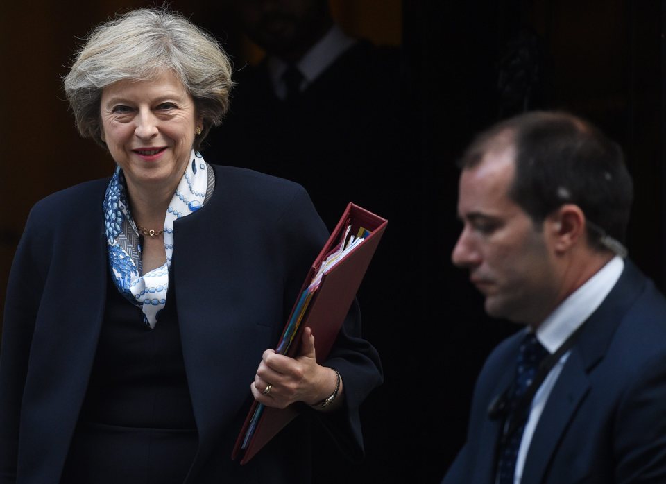 Theresa May leaves 10 Downing street to attend PMQs this morning