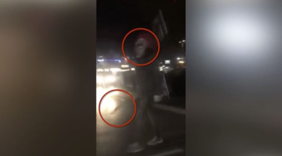 Terrifying ... Killer clown was spotted holding what appeared to be a sword