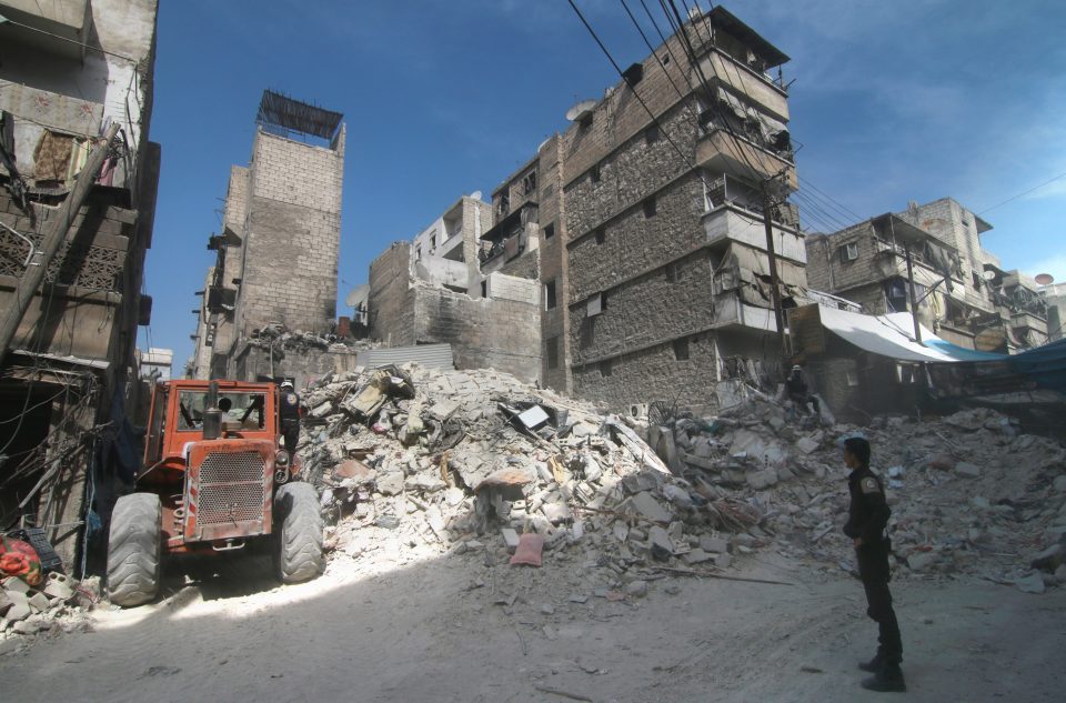 Collapsed buildings are pictured in Aleppo following the air raids yesterday