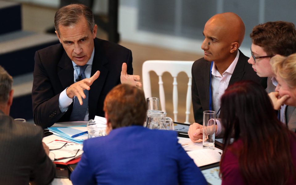 Table topping . . . Carney chats at conference where he issued warning