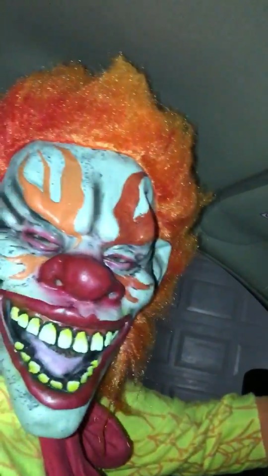 The people driving the car turn out to be wearing scary masks