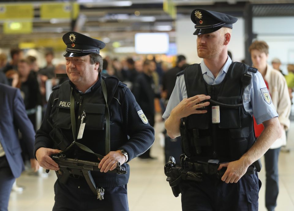 Cops guard Schoenefeld Airport near Berlin following the capture of ISIS-linked Al Bake