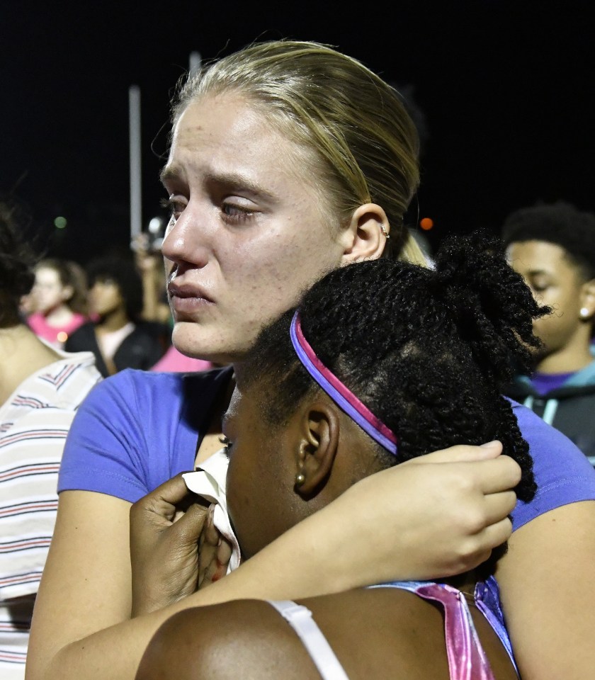Classmates of Trinity Gay embraced as they remembered their tragic classmate