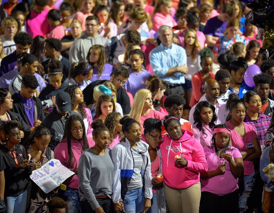 Crowds gathered to pay their respects to the slain young sprinter at her high school in Kentucky 
