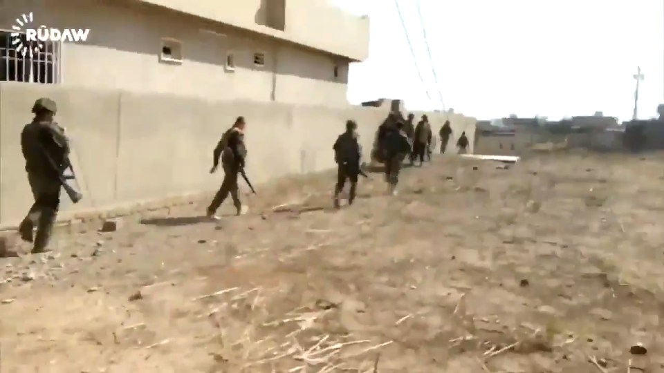 The fighter reaches the relative safety of a building