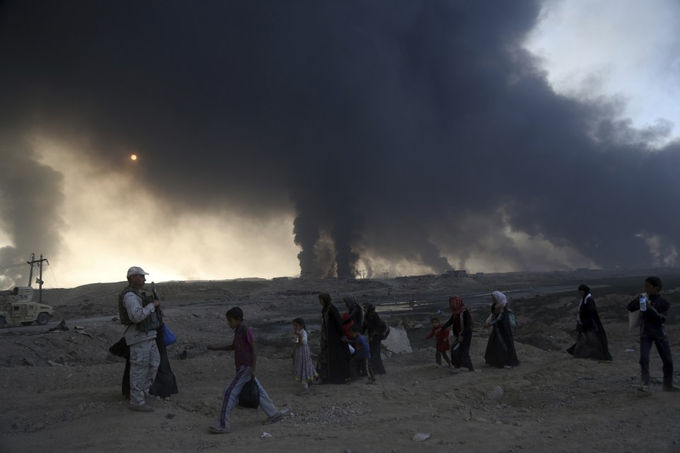 Women and children freed from the clutches of ISIS flee Mosul