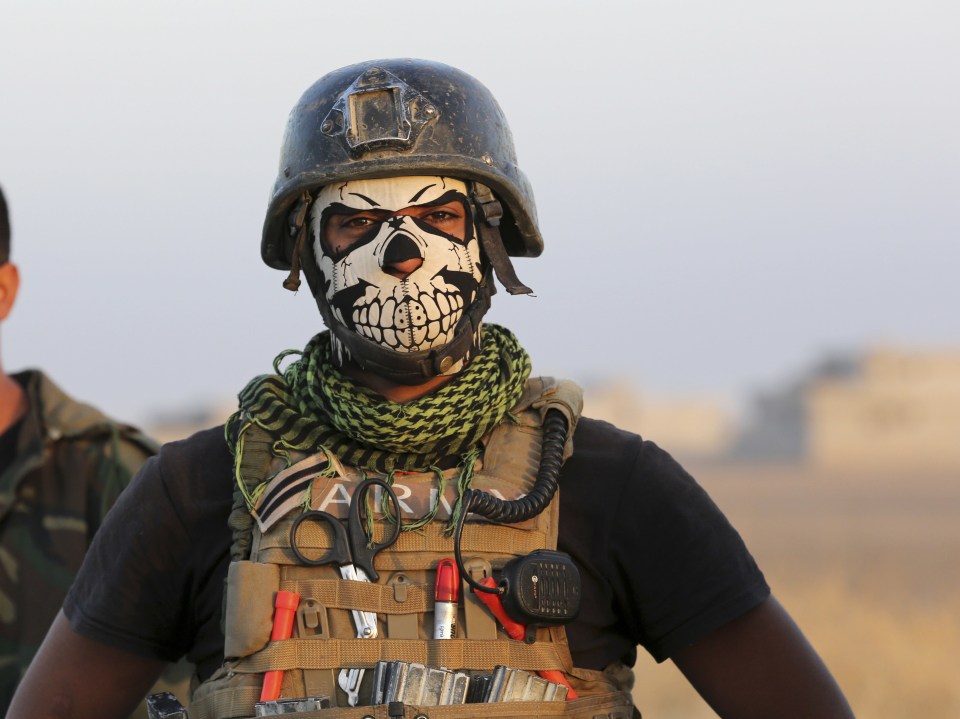 One of Iraqs elite special forces soldiers poses for a photo having joined the battle for Mosul just this morning
