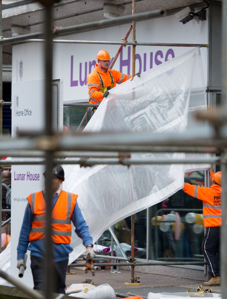 White sheeting has been pulled up in front of the Home Office building in Croydon
