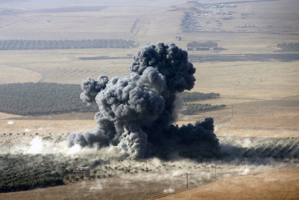 Smoke rises at Islamic State militants' positions in the town of Naweran, near Mosul