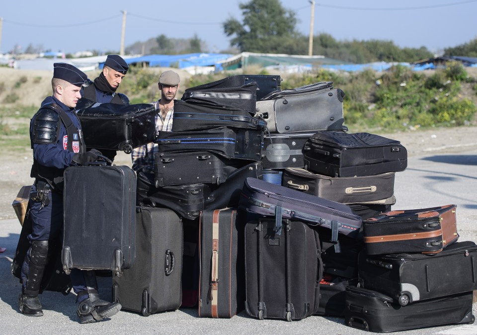 Suitcases and rucksacks have been handed out to migrants to pack up their belongings
