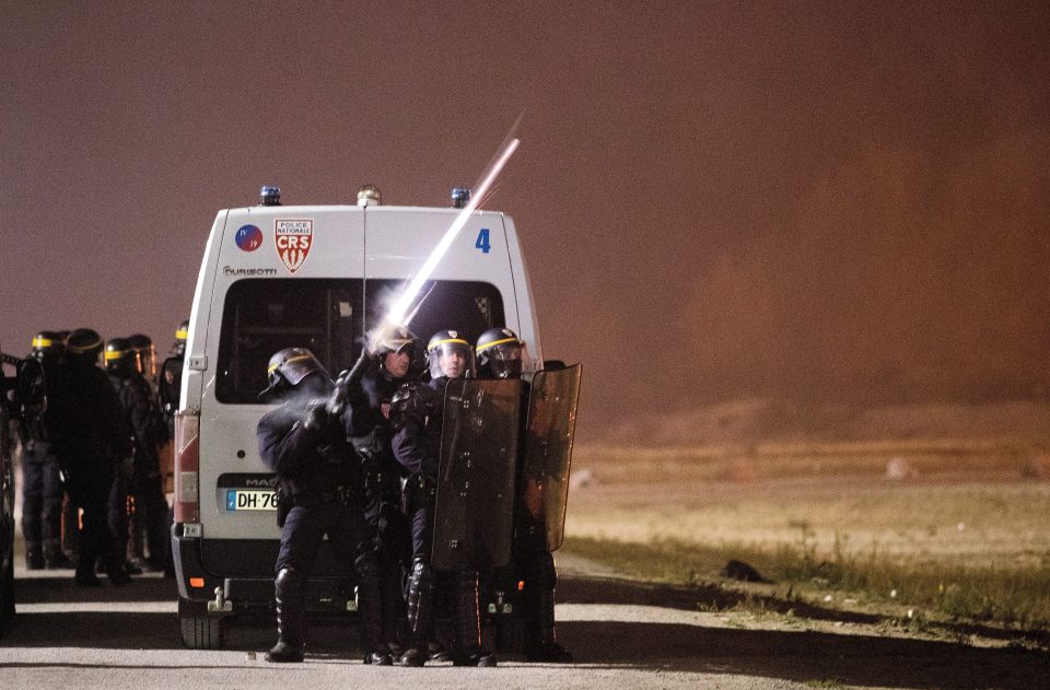 Police used tear gas to disperse migrants and protesters who gathered ahead of the closure 