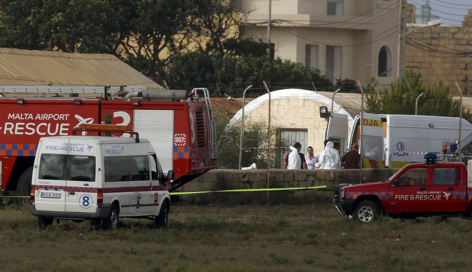 An ambulance and fire engine are seen parked at the accident