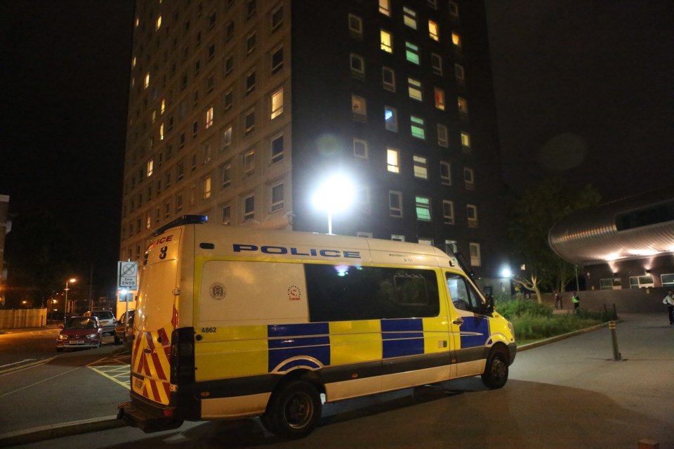 A police van outside Edgbaston House following the attack on a man in the garden area