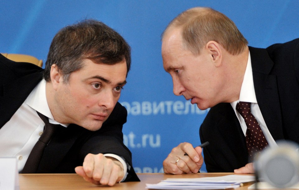 Vladislav Surkov, pictured with the Russian president, is one of Putin's closest aides