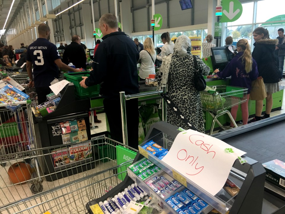 Cash only signs at Asda in Milton Keynes caused furious queues of customers