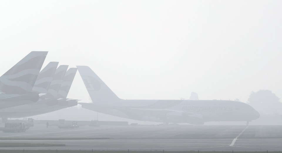 Planes in the fog at Heathrow Airport today 