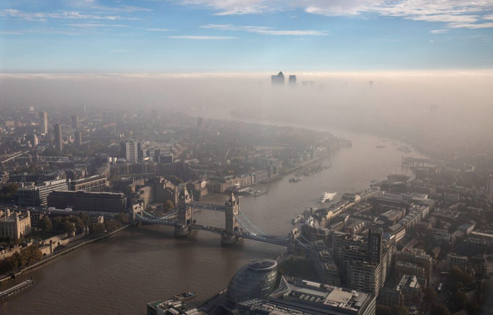 A general view of Tower Bridge and the city through the fog, at The Shard on October 31