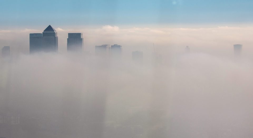 A general view of Canary Wharf through the fog, at The Shard on October 31