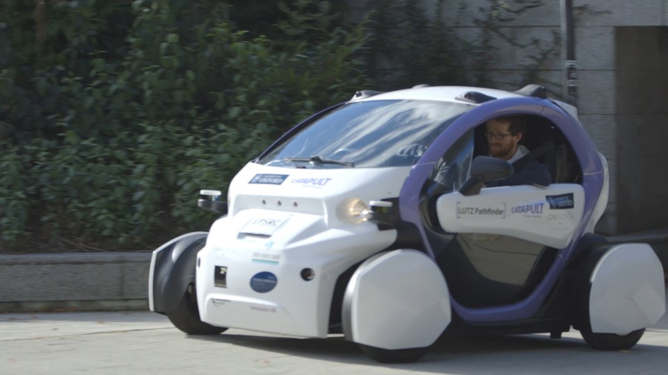 Driverless cars take to the streets during Britain's first self-driving pod trial