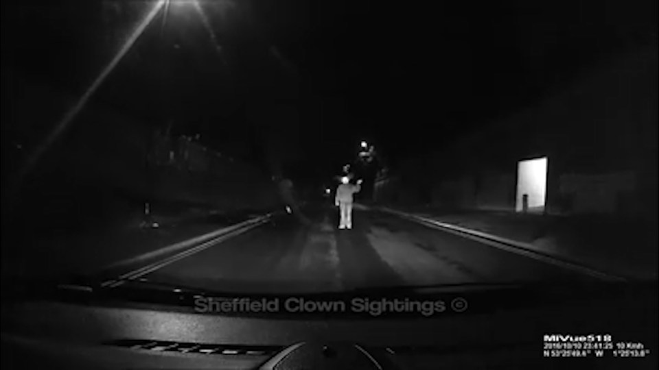 The masked figure even gave a creepy wave to the terrified family 