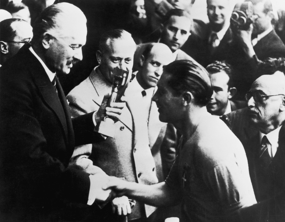 Italian captain Giuseppe Meazza receives the Jules Rimet trophy after his team's 4-2 victory over Hungary in the World Cup final at the Stade Olympique de Colombes, Paris. (Photo by Keystone/Hulton Archive/Getty Images)