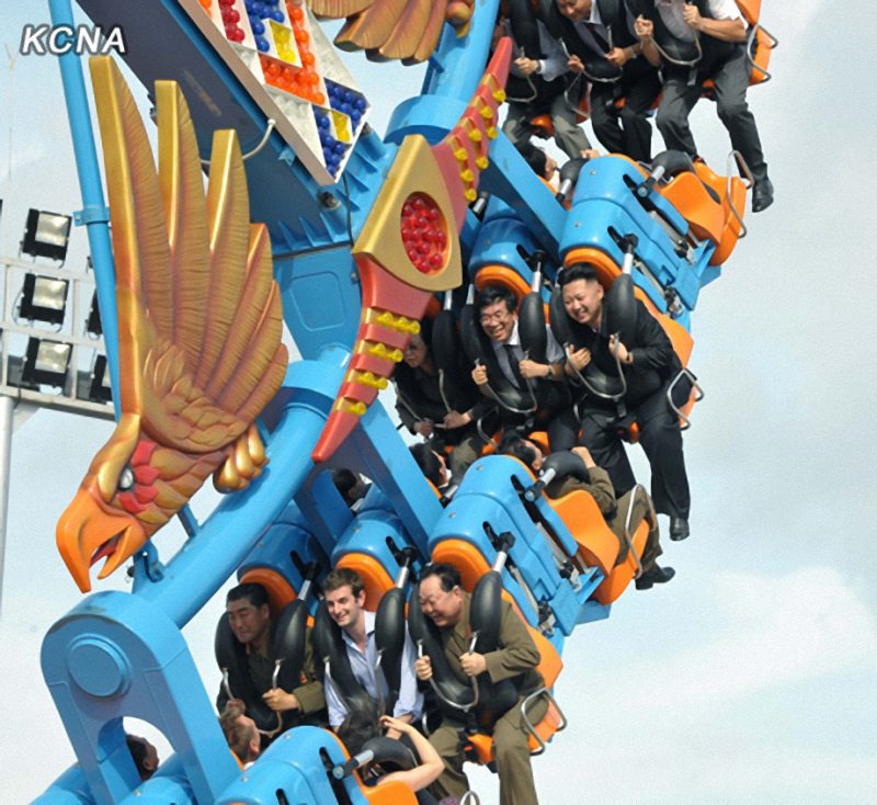  Jong-un (R in second row) smiles while enjoying a ride at the tourist favourite, the Rungna People's Pleasure Ground in Pyongyang 