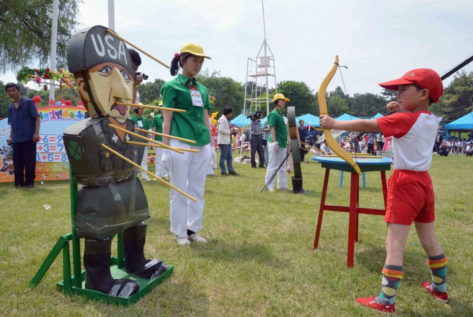 A child shoots an arrow at an effigy of a U.S. soldier at an amusement park in Pyongyang 