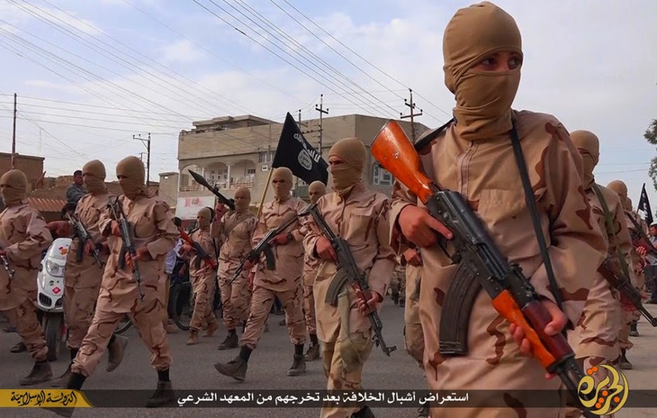 Warped ...a still from an ISIS propaganda video showing the kiddie soliders in action