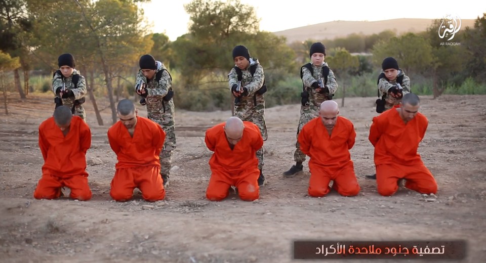 Young boys are pictured murdering adult hostages 