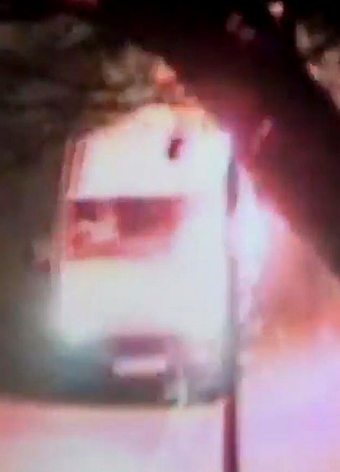 The firework explodes on the van, which had pulled over after coming under attack