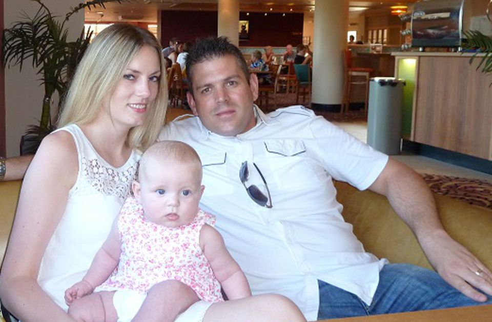 His wife, Lindsey, pictured with Mr Briggs and their daughter, told court she wants doctors to stop treating her husband