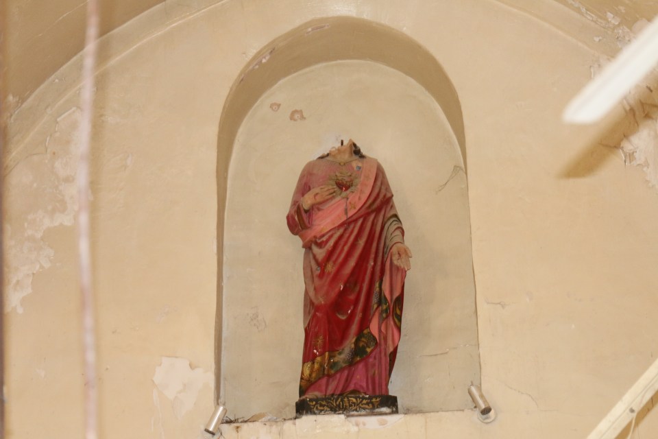 Shocking pictures showed a statue of Jesus beheaded by the sick terror thugs